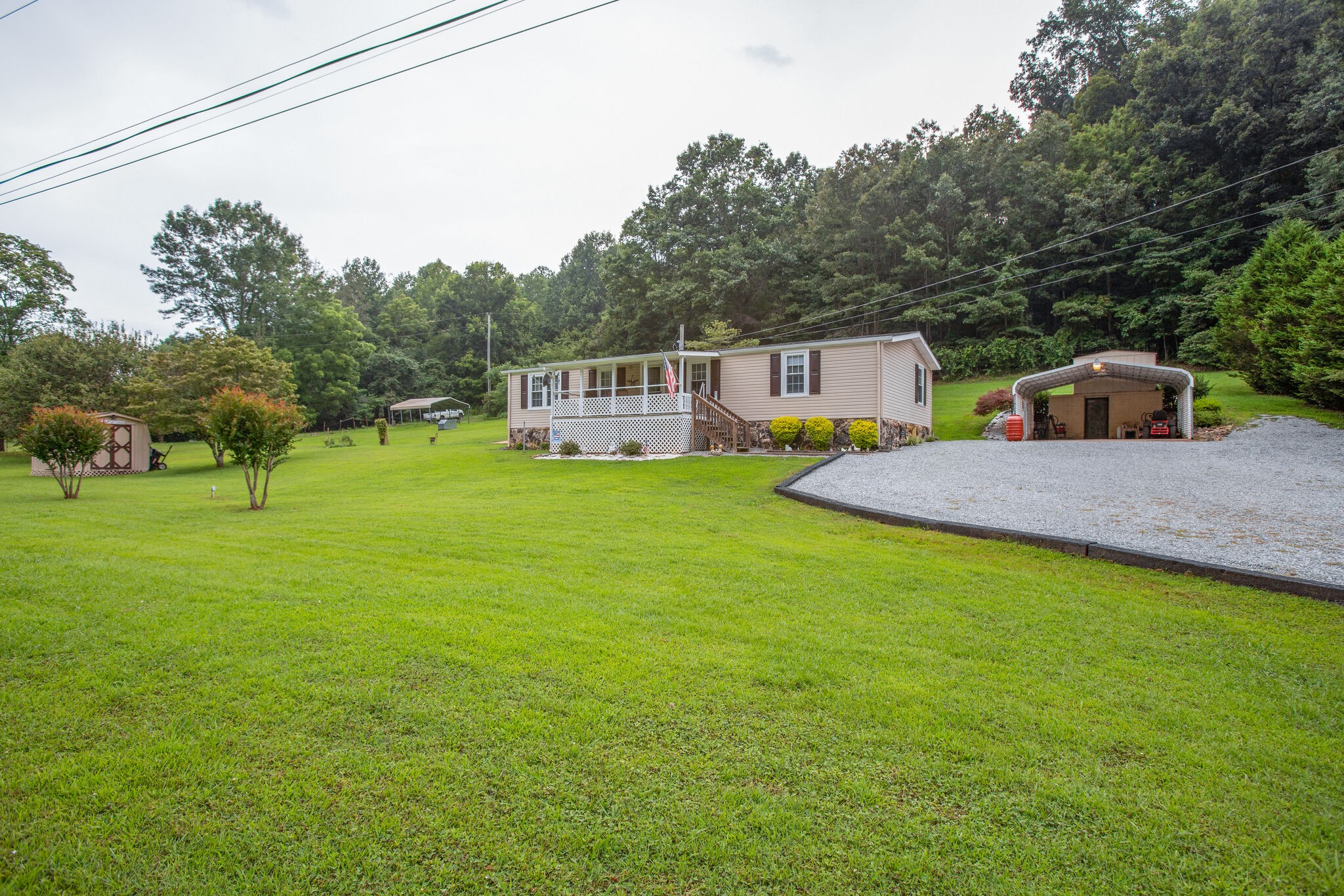 56 Morgan Road Lawrenceburg, TN 38464 - Photo 3 of 30 a backyard of a house with table and chairs