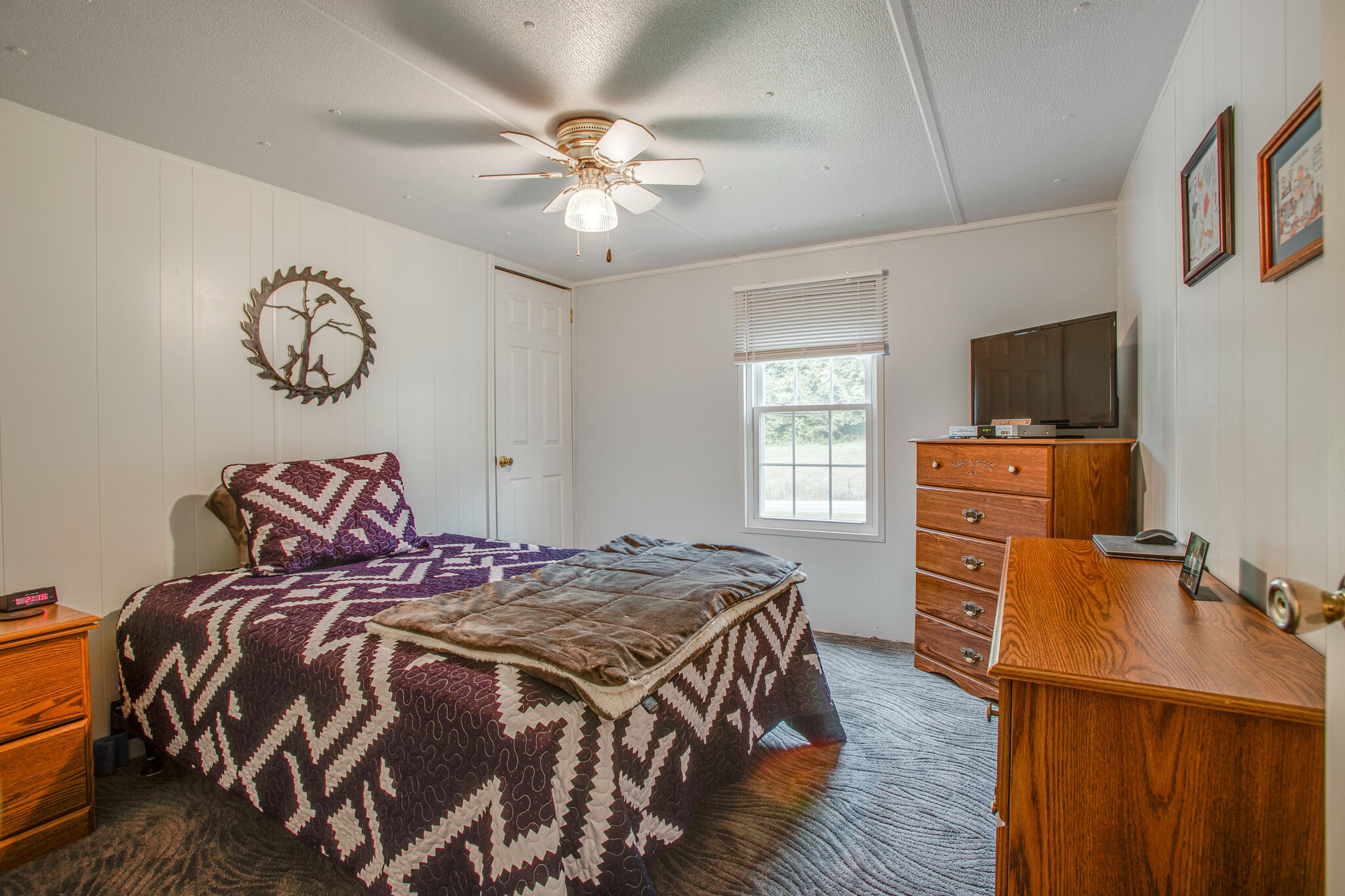 56 Morgan Road Lawrenceburg, TN 38464 - Photo 21 of 30 a bedroom with a bed and wooden floor