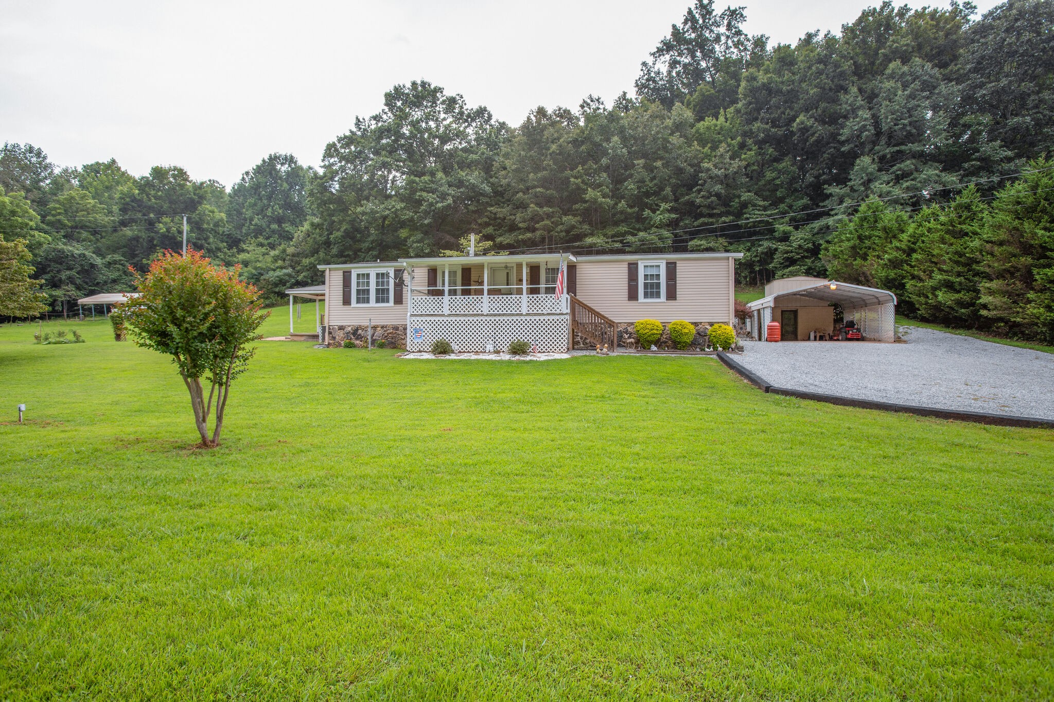 56 Morgan Road Lawrenceburg, TN 38464 - Photo 4 of 30 a house view with a garden space