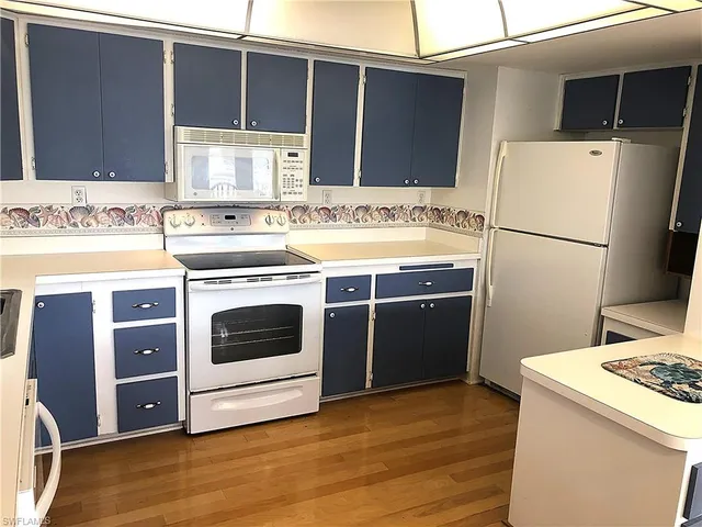 a view of a a dining room with furniture window and outside view