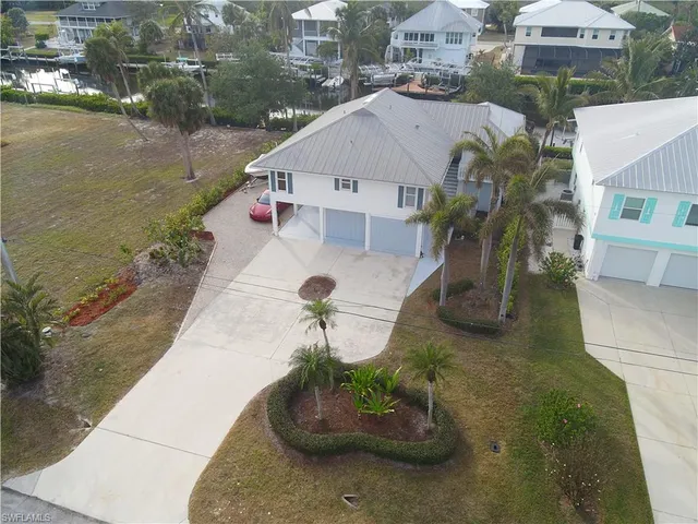 a aerial view of a house with a yard