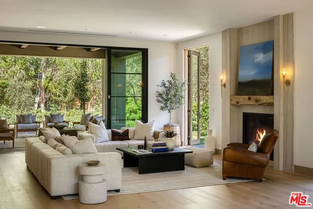 a view of a workspace with furniture and a flat screen tv