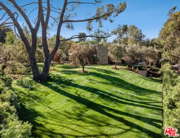 an aerial view of a house with a lake view