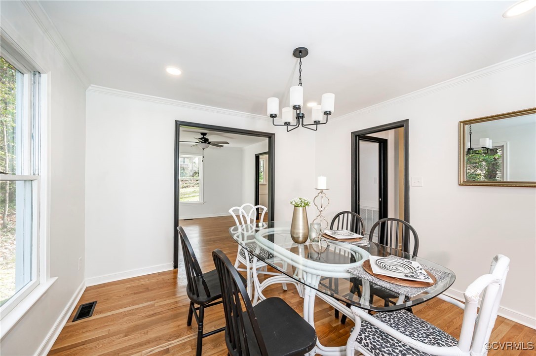 4117 Poplar Grove Road Midlothian, VA 23112 - Photo 13 of 31 a view of a dining room with furniture and wooden floor