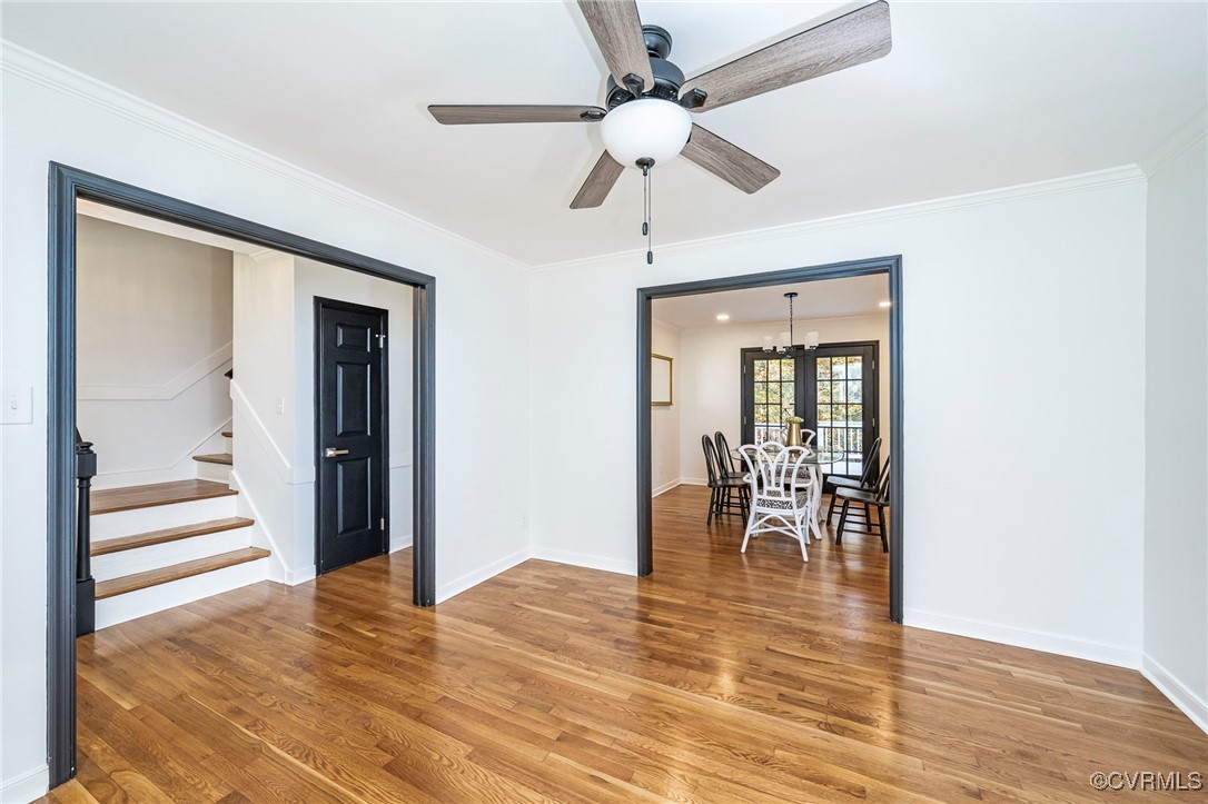 4117 Poplar Grove Road Midlothian, VA 23112 - Photo 14 of 31 a view of a hallway with wooden floor a chandelier and living room