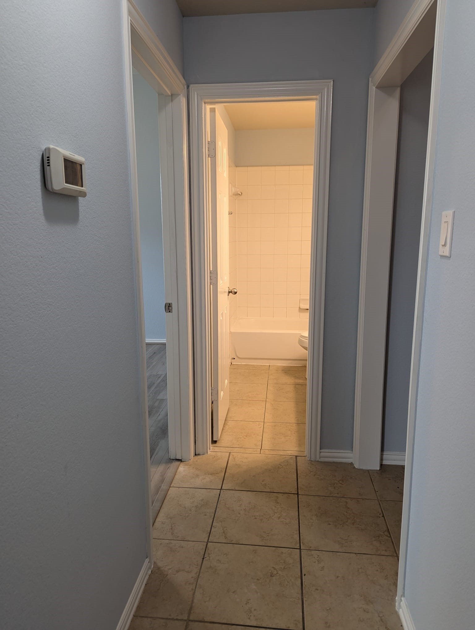 8041 Silent Deep Drive Rosenberg, TX 77469 - Photo 18 of 24 Inviting hallway leading to the second and third bedrooms.