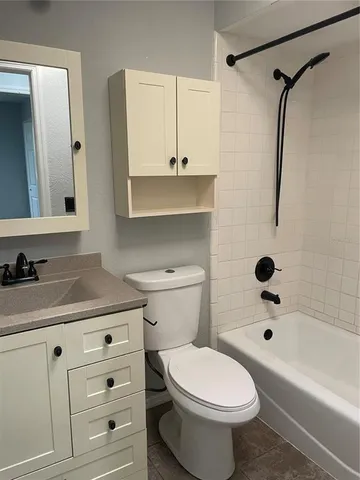 a bathroom with a sink a toilet and a bathtub