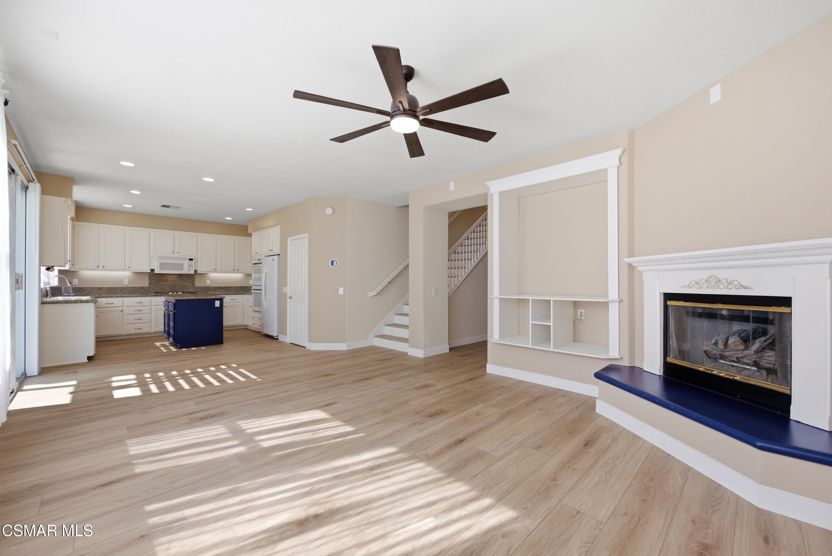 4884 Borders Street Simi Valley, CA 93063 - Photo 11 of 44 a living room with a couch and a fireplace