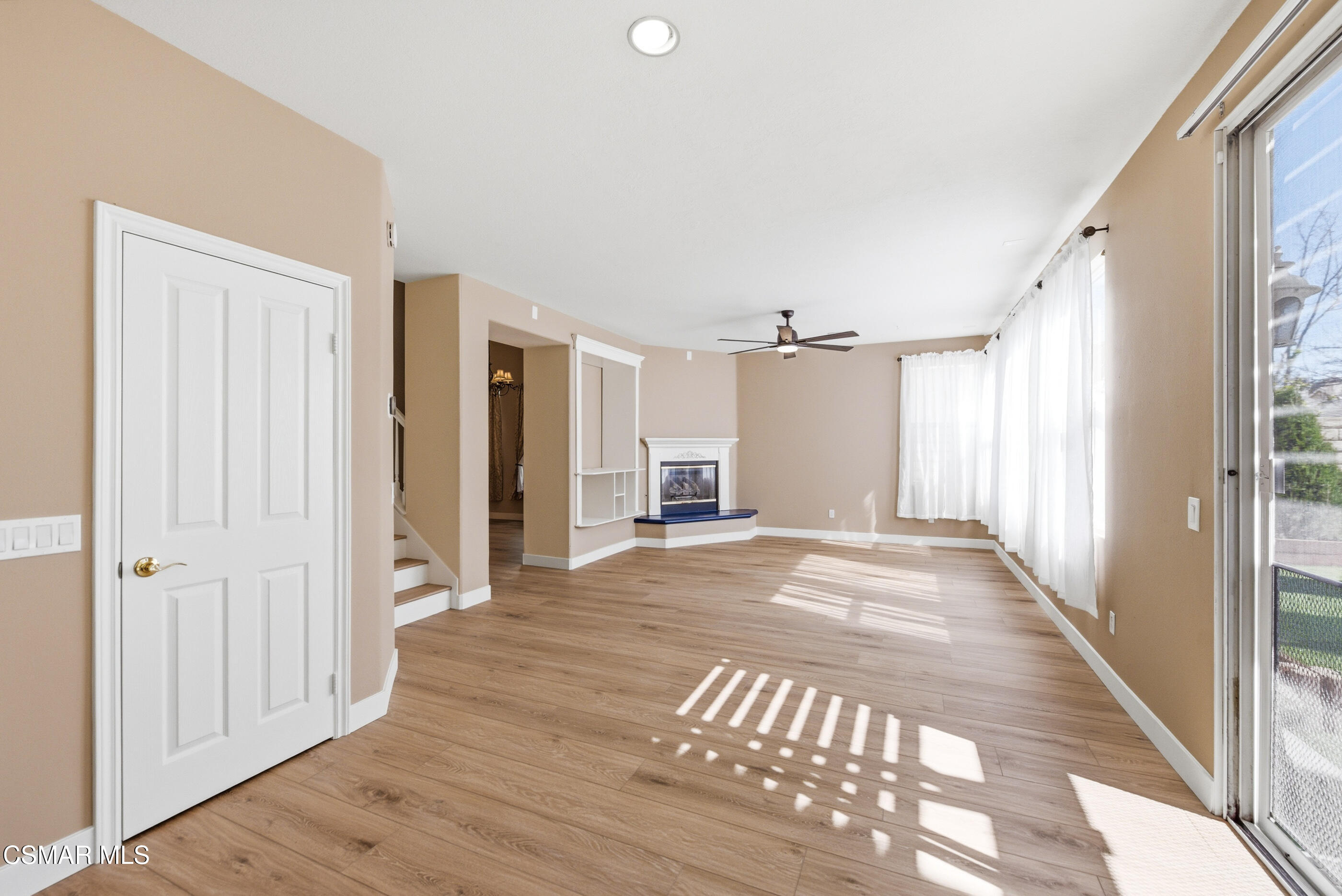 4884 Borders Street Simi Valley, CA 93063 - Photo 19 of 44 a view of a hallway with wooden floor and cabinet