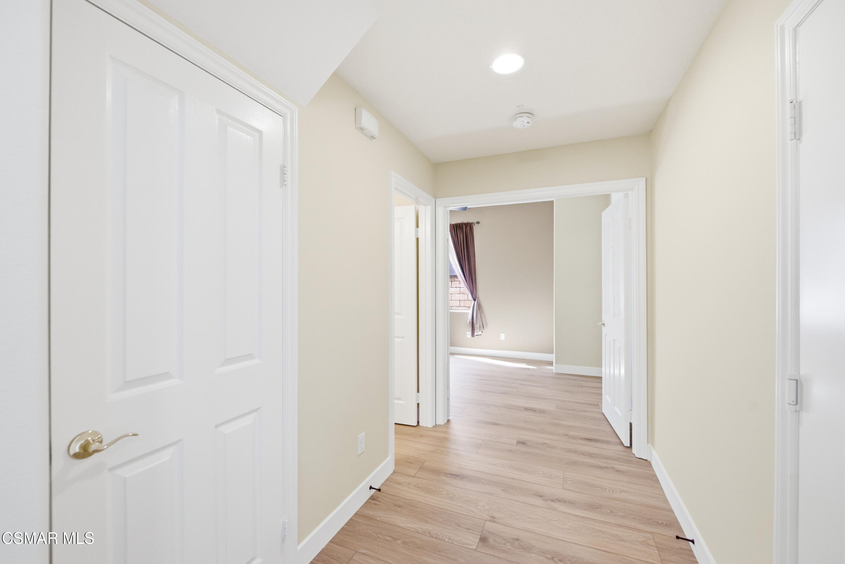 4884 Borders Street Simi Valley, CA 93063 - Photo 20 of 44 a view of a hallway with wooden floor