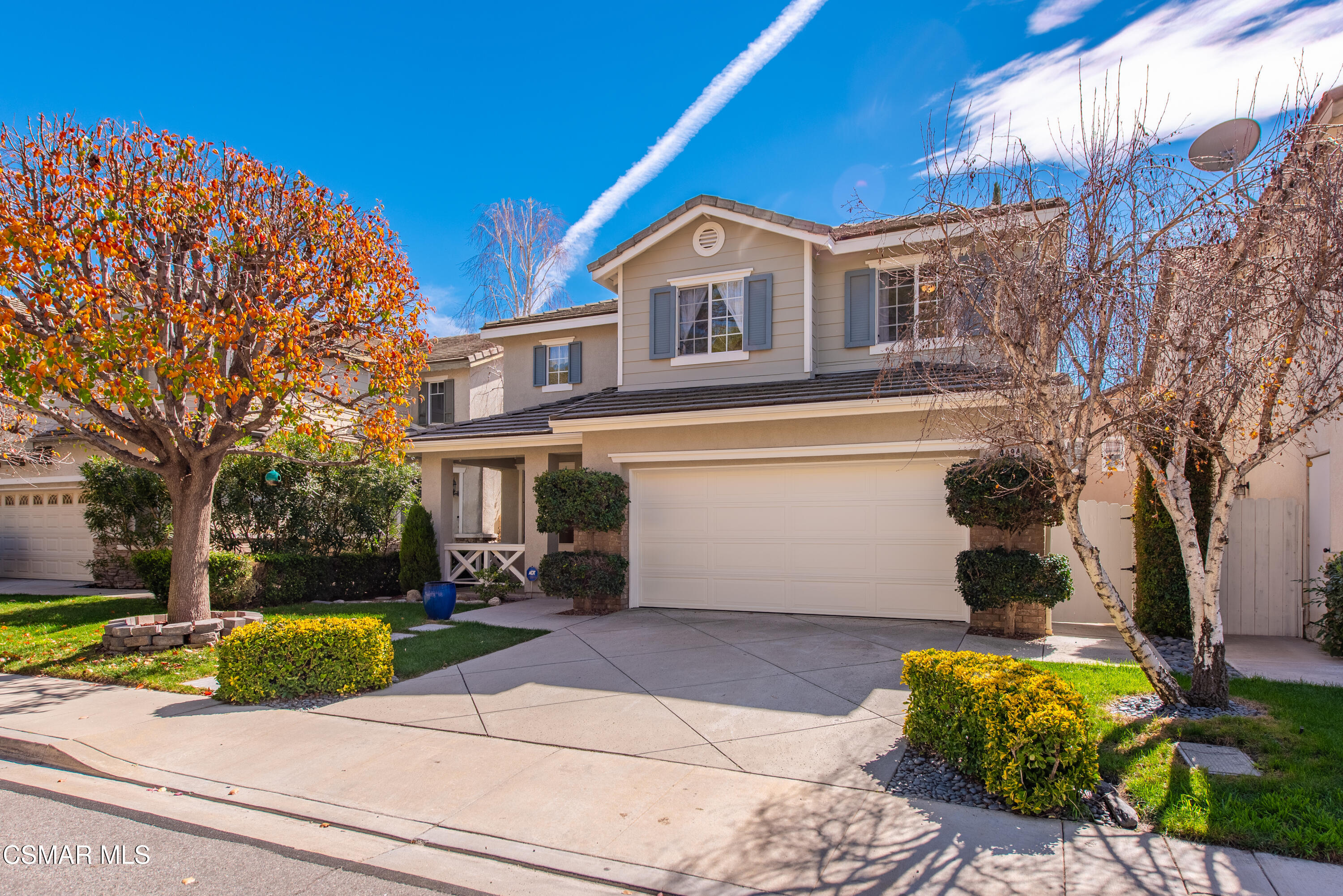 4884 Borders Street Simi Valley, CA 93063 - Photo 2 of 44 a front view of a house with garden