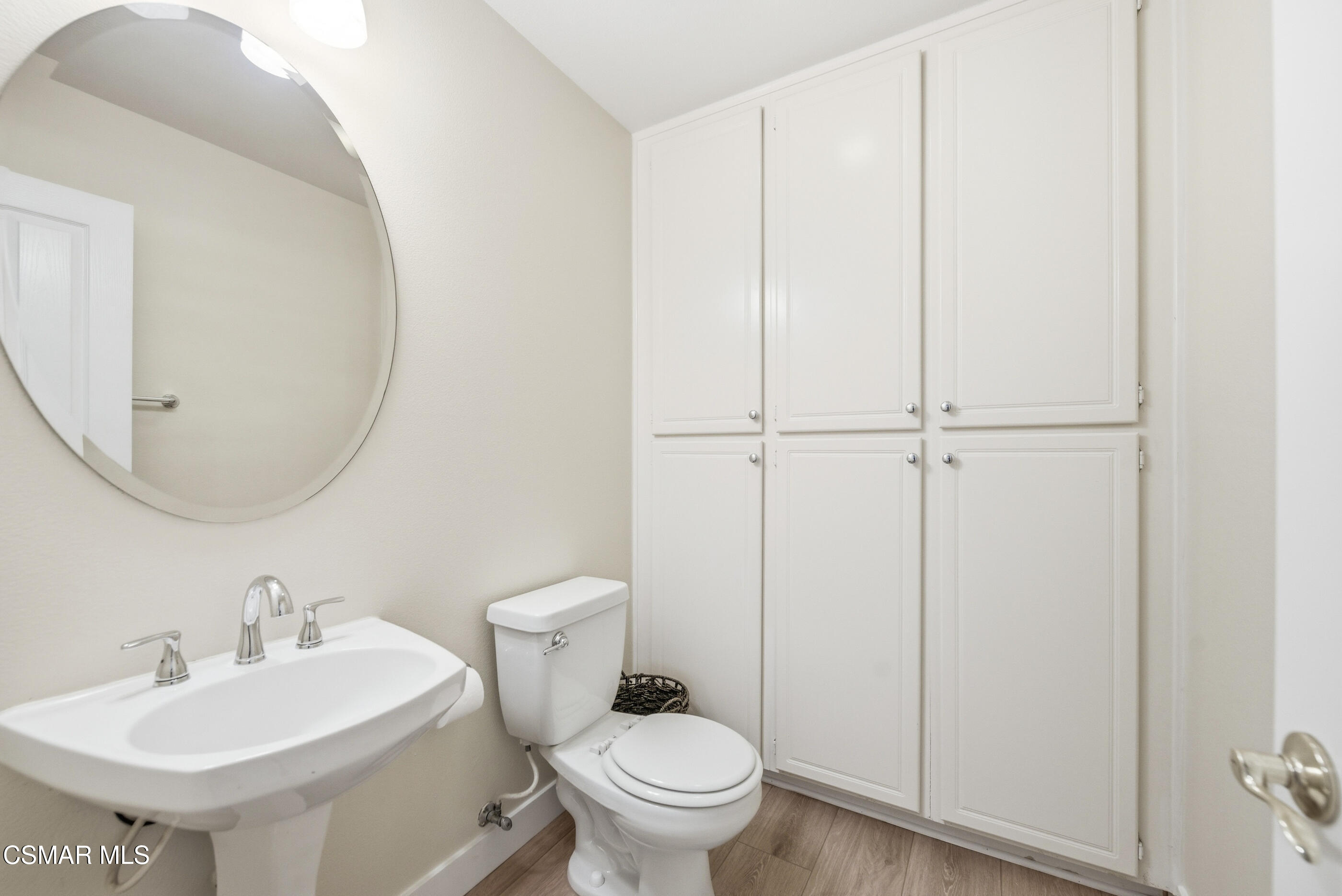 4884 Borders Street Simi Valley, CA 93063 - Photo 22 of 44 a bathroom with a toilet a sink and a mirror