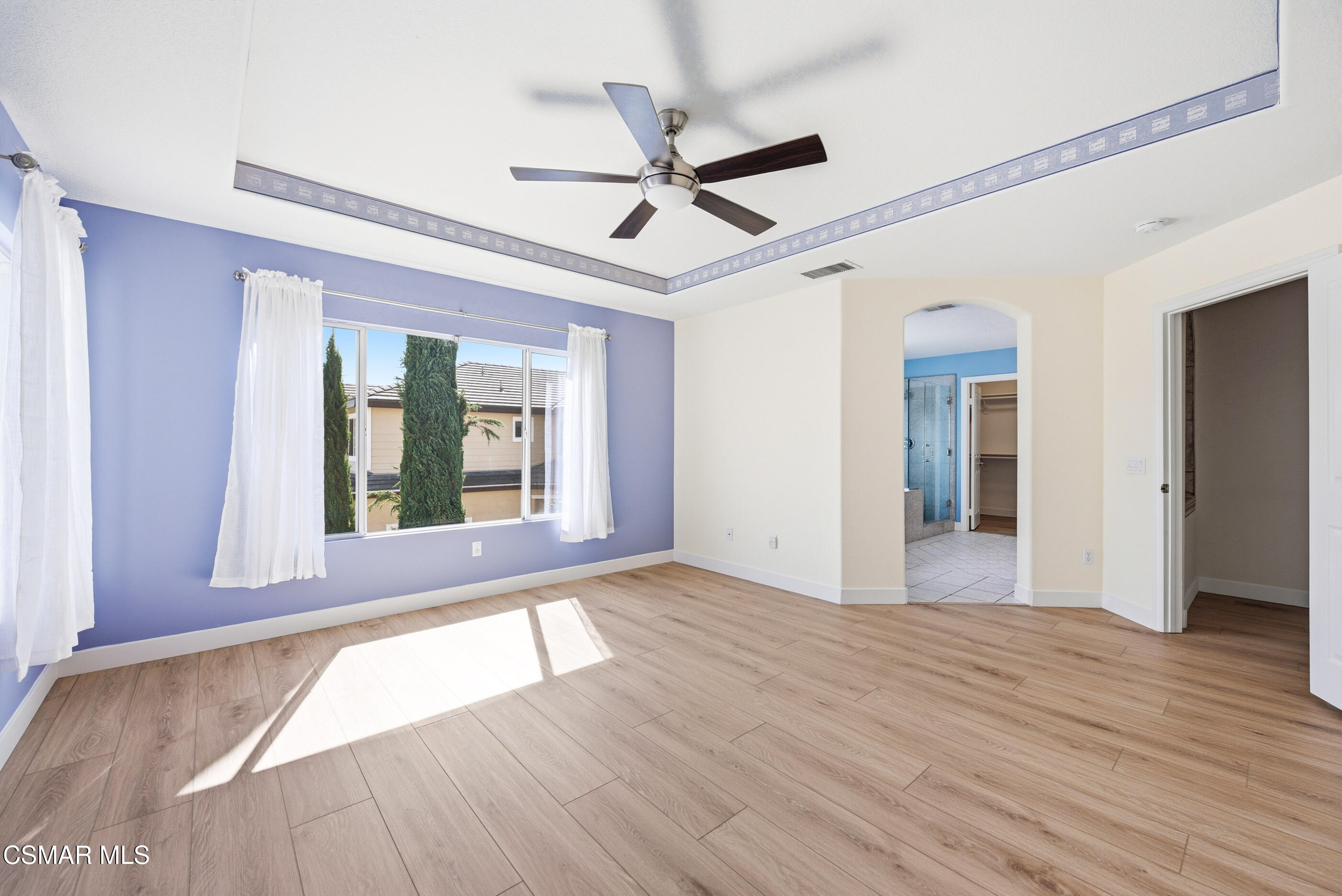 4884 Borders Street Simi Valley, CA 93063 - Photo 28 of 44 a view of empty room with wooden floor and fan