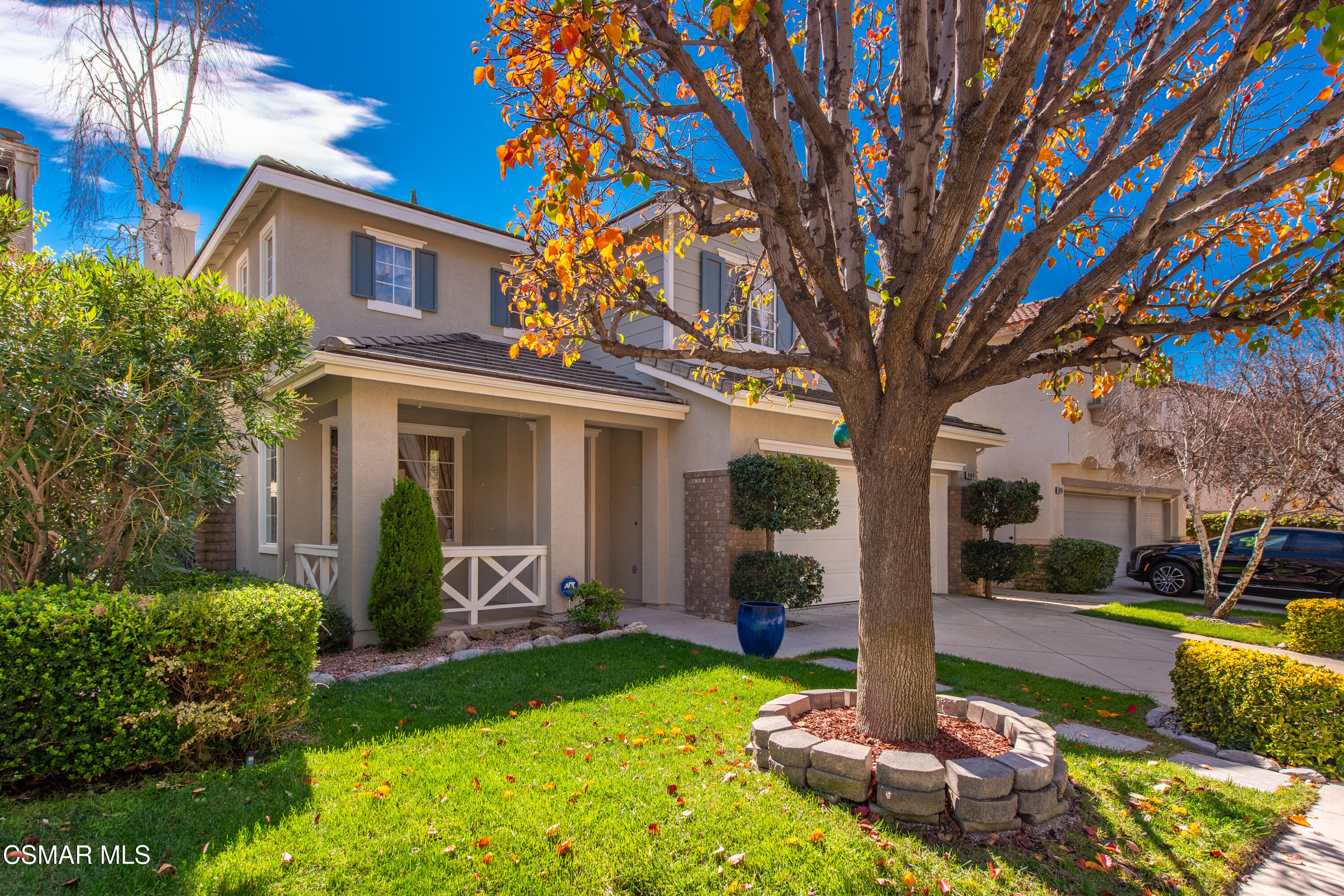4884 Borders Street Simi Valley, CA 93063 - Photo 3 of 44 a front view of a house with garden