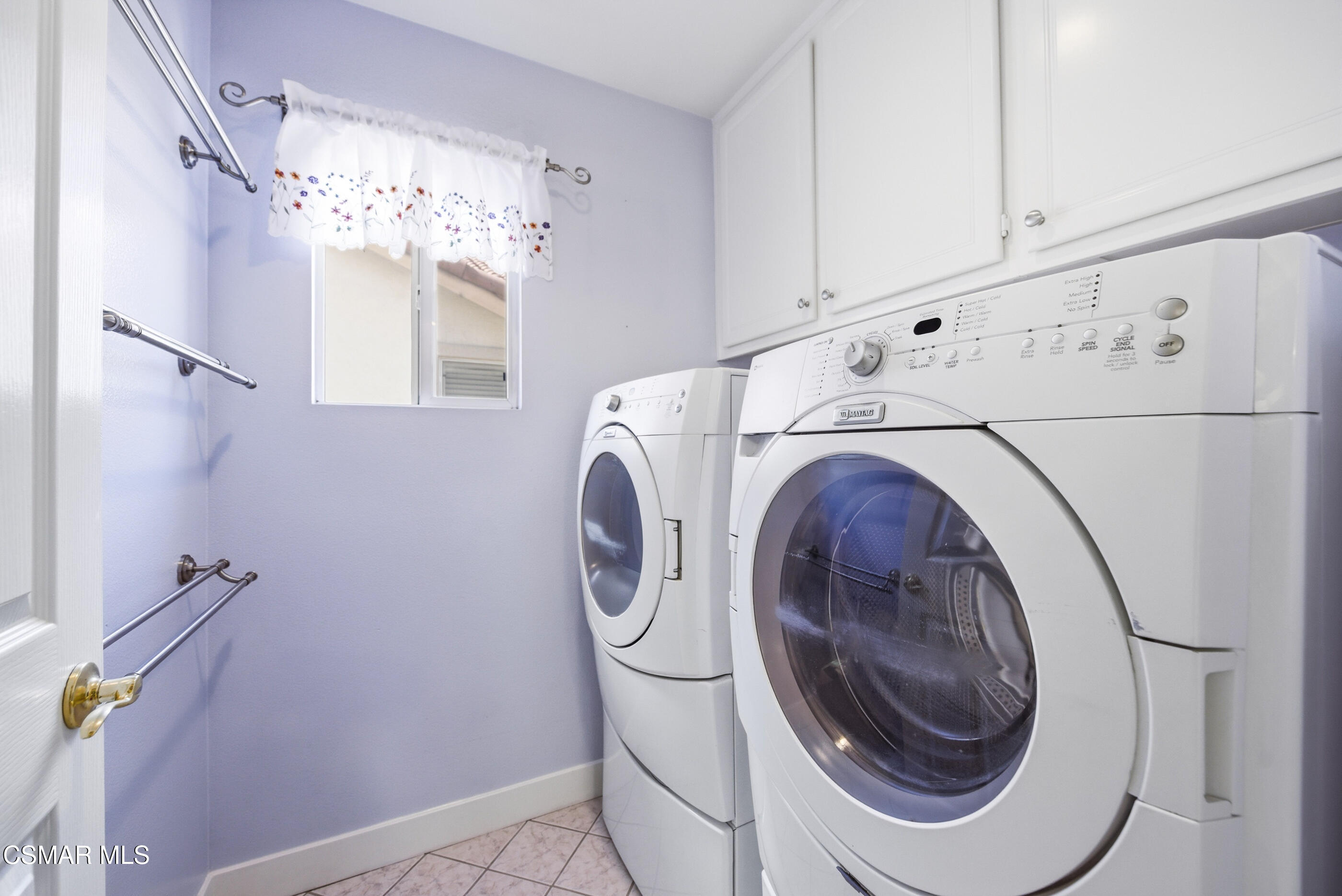 4884 Borders Street Simi Valley, CA 93063 - Photo 35 of 44 a utility room with dryer and washer
