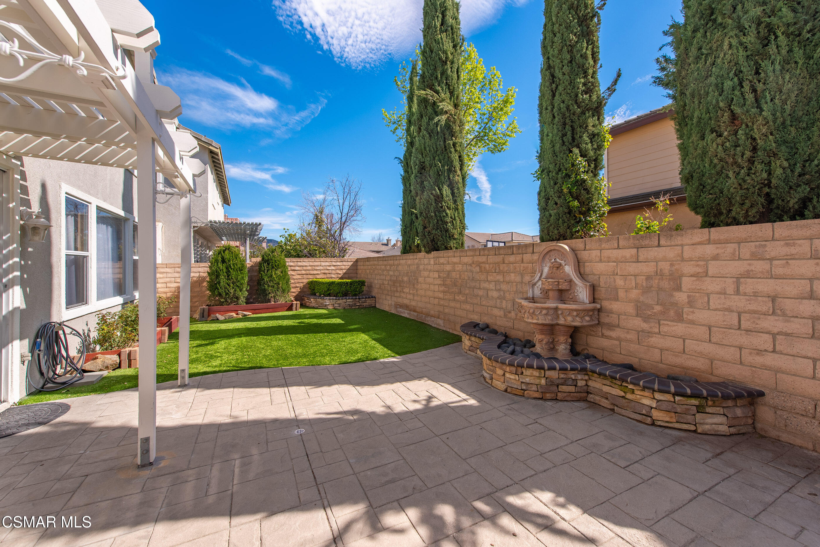 4884 Borders Street Simi Valley, CA 93063 - Photo 38 of 44 a view of a house with a street