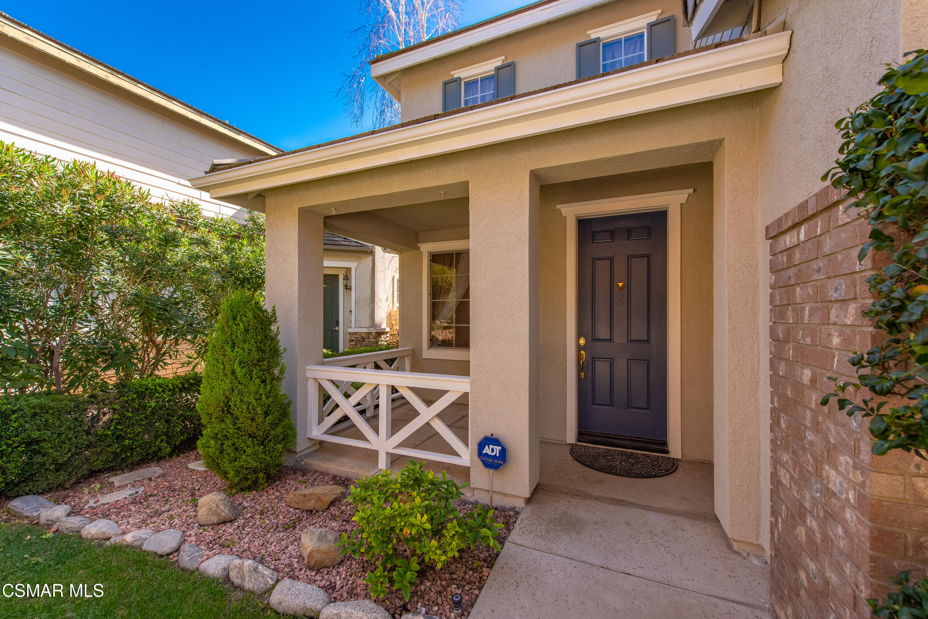 4884 Borders Street Simi Valley, CA 93063 - Photo 4 of 44 a view of a front door and a potted plant