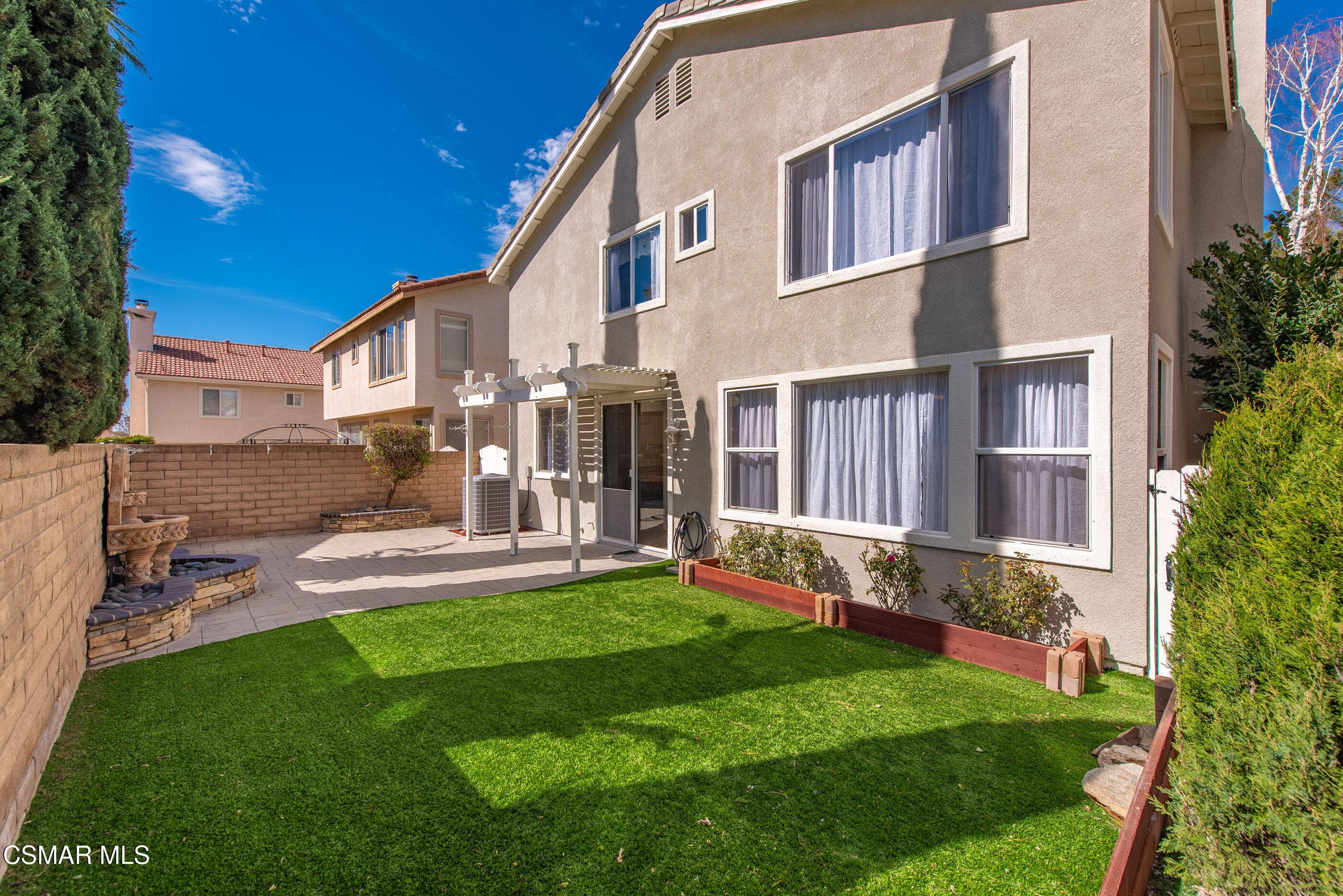 4884 Borders Street Simi Valley, CA 93063 - Photo 43 of 44 a view of a house with a yard and sitting area