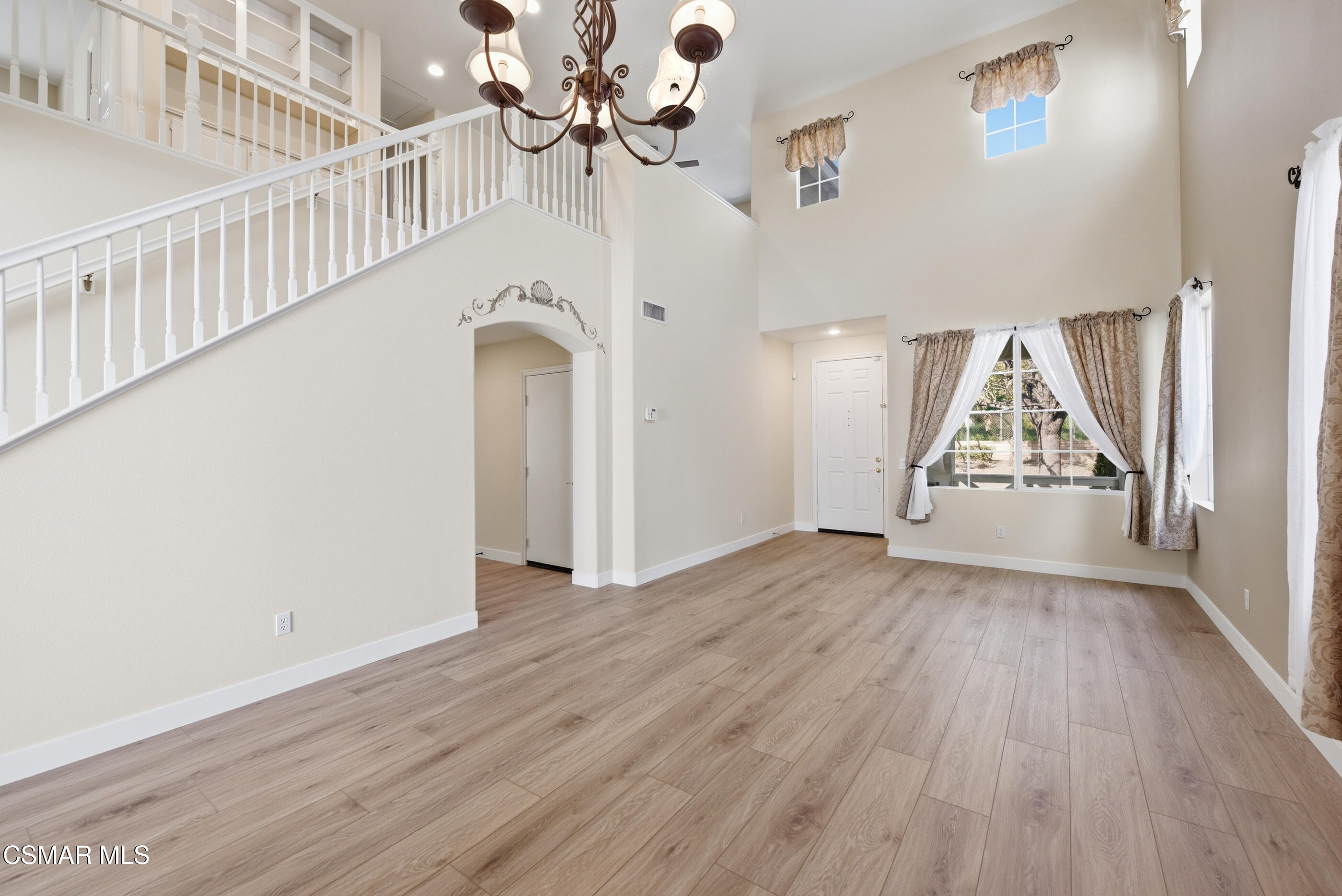 4884 Borders Street Simi Valley, CA 93063 - Photo 5 of 44 wooden floor in an empty room with a window