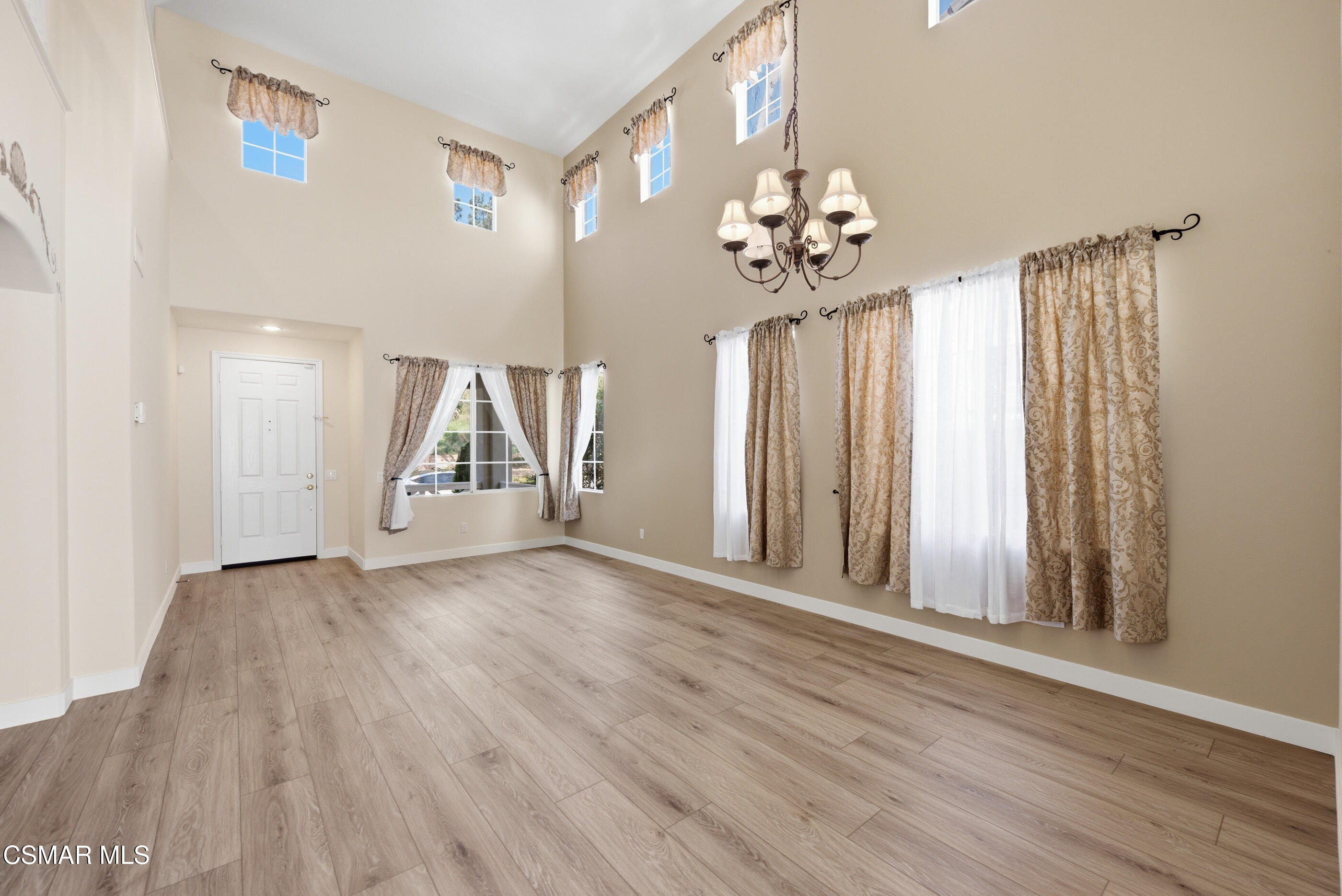 4884 Borders Street Simi Valley, CA 93063 - Photo 7 of 44 wooden floor in an empty room with a window