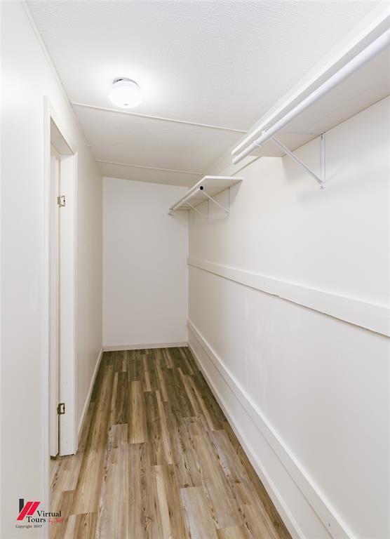4947 Quiet Acres Road Shreveport, LA 71107 - Photo 16 of 39 Walk in closet with light wood finished floors