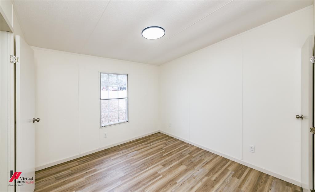 4947 Quiet Acres Road Shreveport, LA 71107 - Photo 17 of 39 Empty room featuring light wood-style flooring