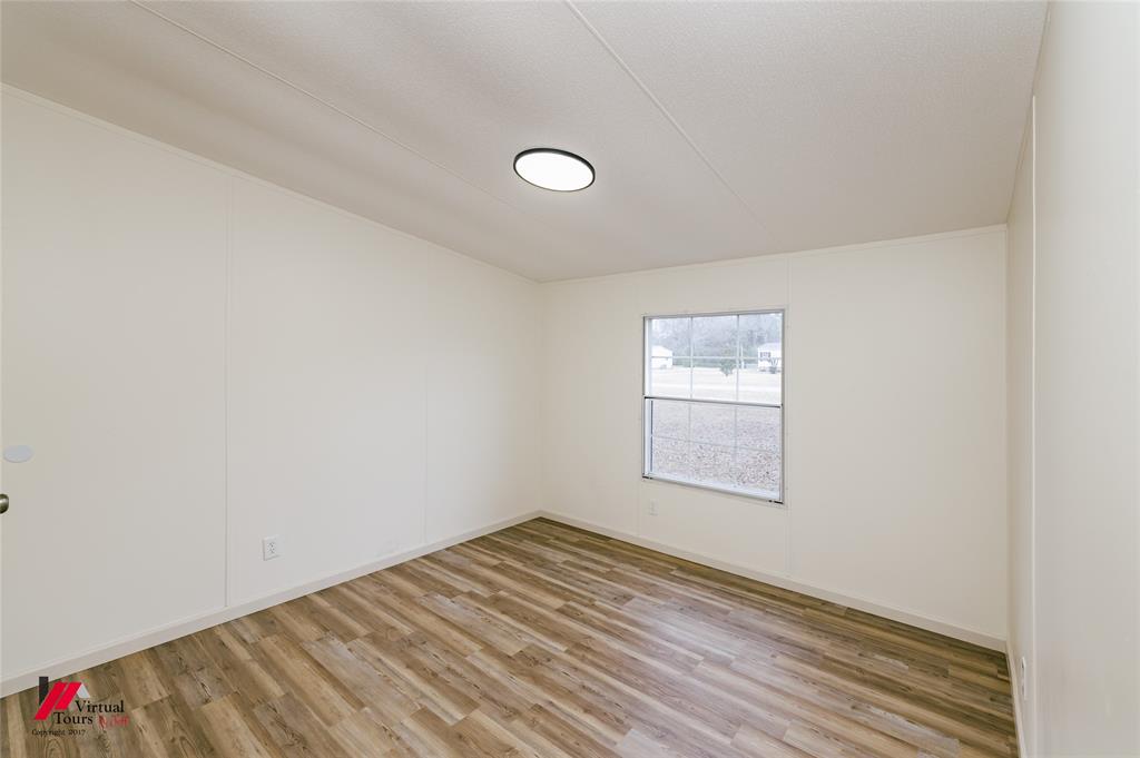 4947 Quiet Acres Road Shreveport, LA 71107 - Photo 26 of 39 Unfurnished room featuring light wood-style floors