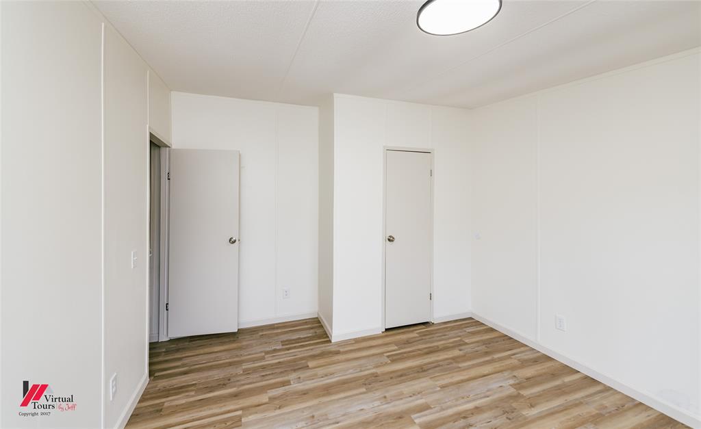 4947 Quiet Acres Road Shreveport, LA 71107 - Photo 27 of 39 Unfurnished bedroom with light wood-style flooring