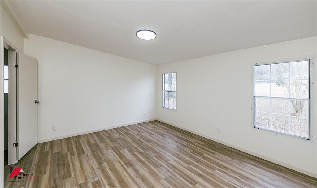 4947 Quiet Acres Road Shreveport, LA 71107 - Photo 29 of 39 Unfurnished room with light wood finished floors and baseboards