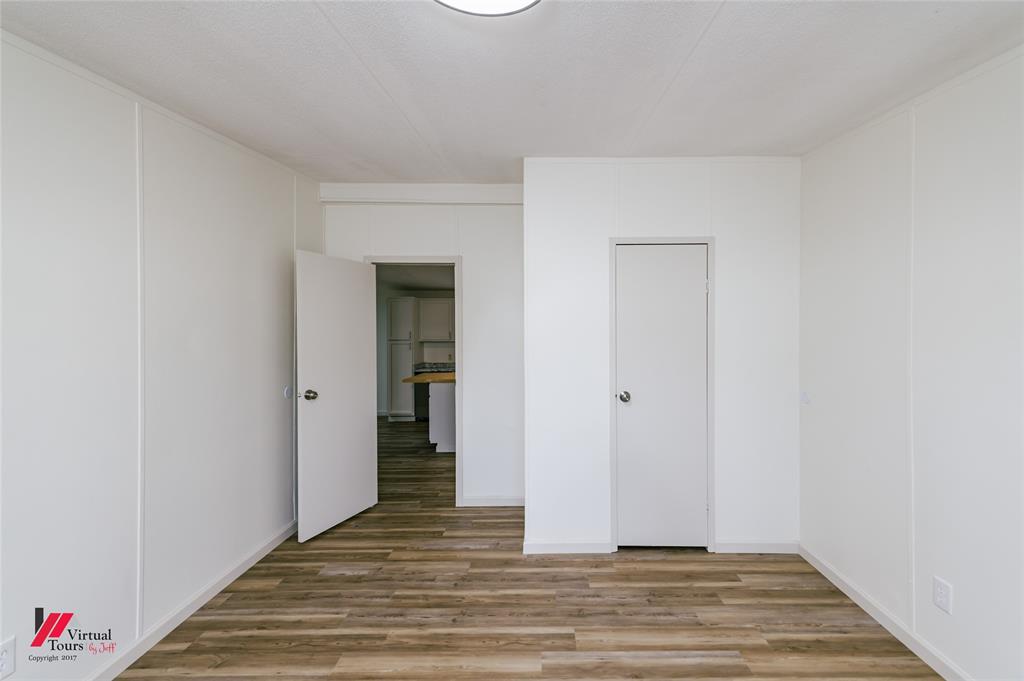 4947 Quiet Acres Road Shreveport, LA 71107 - Photo 30 of 39 Unfurnished bedroom featuring light wood finished floors