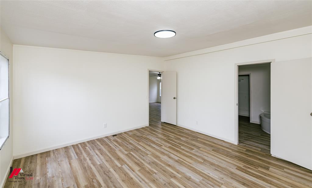 4947 Quiet Acres Road Shreveport, LA 71107 - Photo 9 of 39 Unfurnished room with light wood-style floors and baseboards