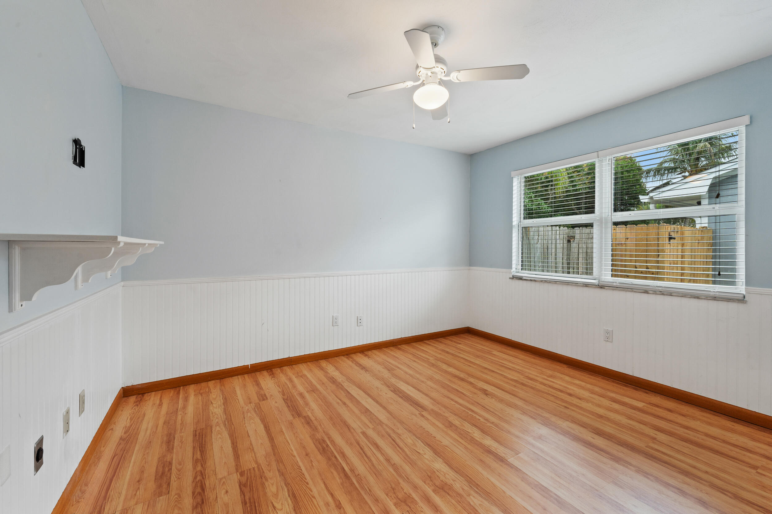 5345 Southeast 52nd Avenue Stuart, FL 34997 - Photo 14 of 32 a view of an empty room with wooden floor and a window