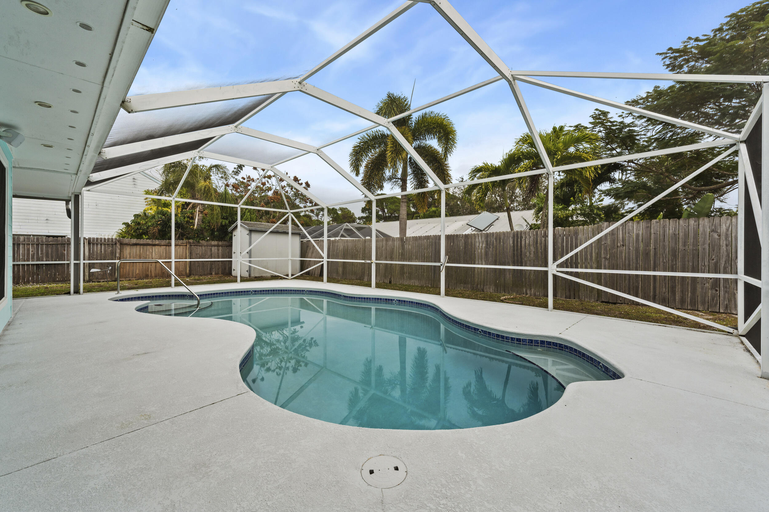 5345 Southeast 52nd Avenue Stuart, FL 34997 - Photo 19 of 32 a view of a swimming pool with a sink and glass door