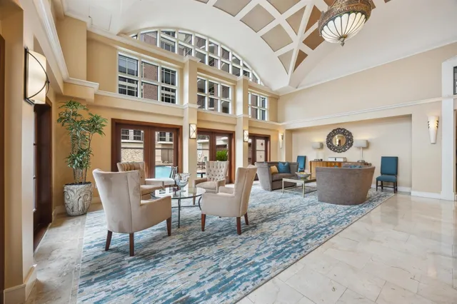 a view of a patio with table and chairs