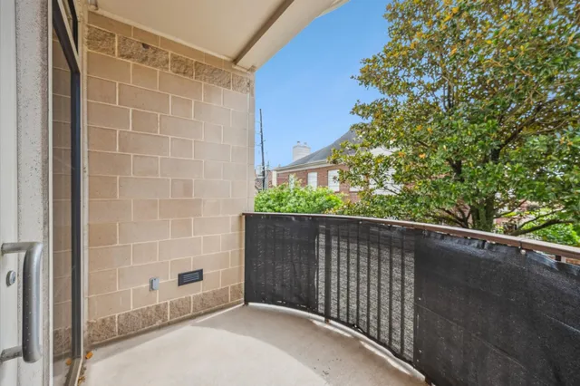 a view of a hallway with wooden shelves