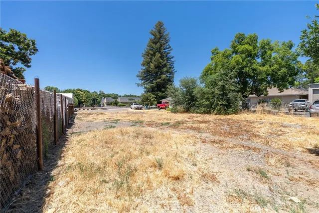 a view of outdoor space with swimming pool and trees
