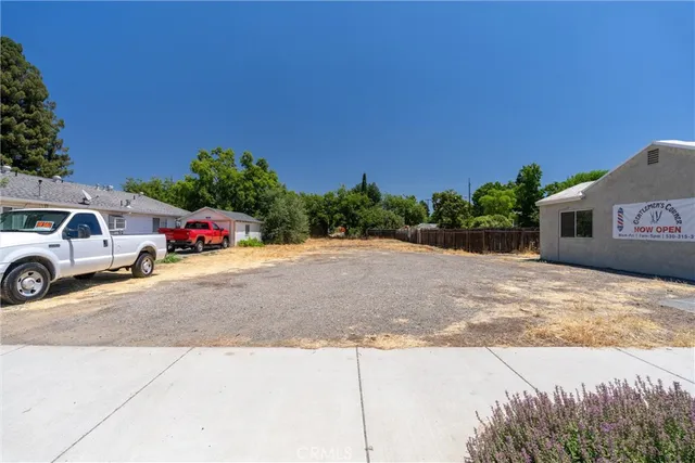 a view of a street with a car parked in front of it