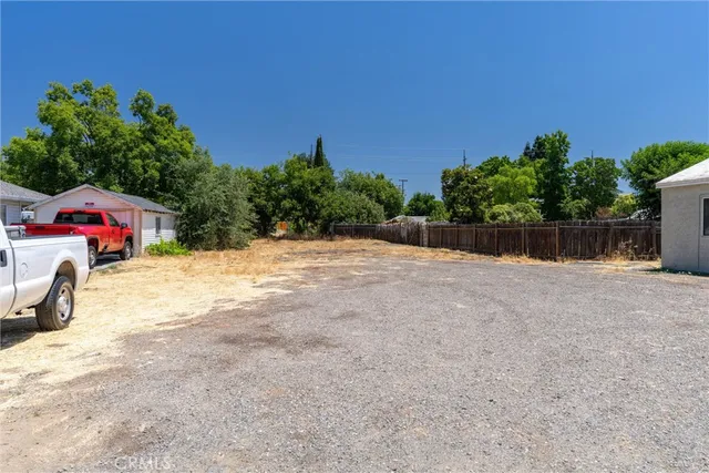 a view of a house with a yard and garage