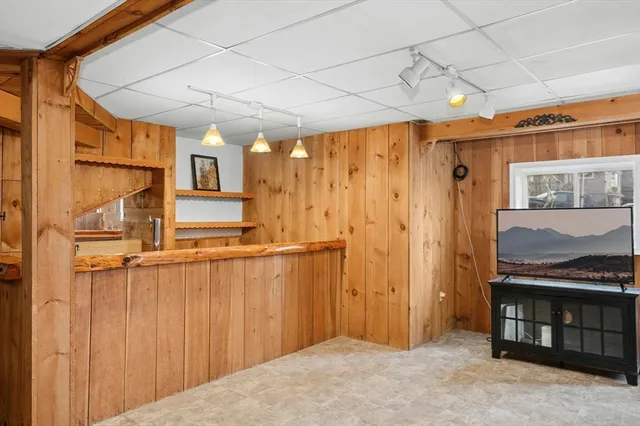 a kitchen with refrigerator and cabinets