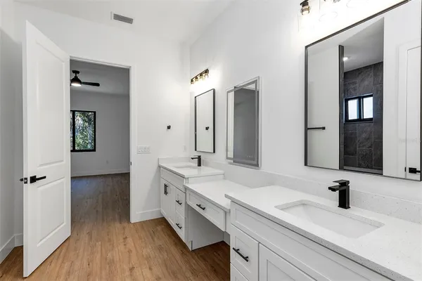a bathroom with a sink and shower