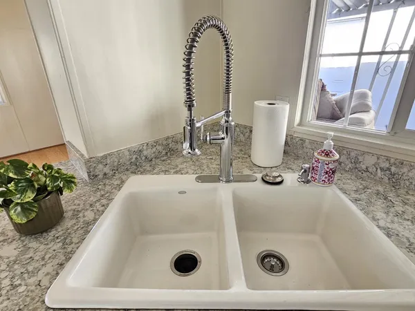 a bathroom with a granite countertop sink