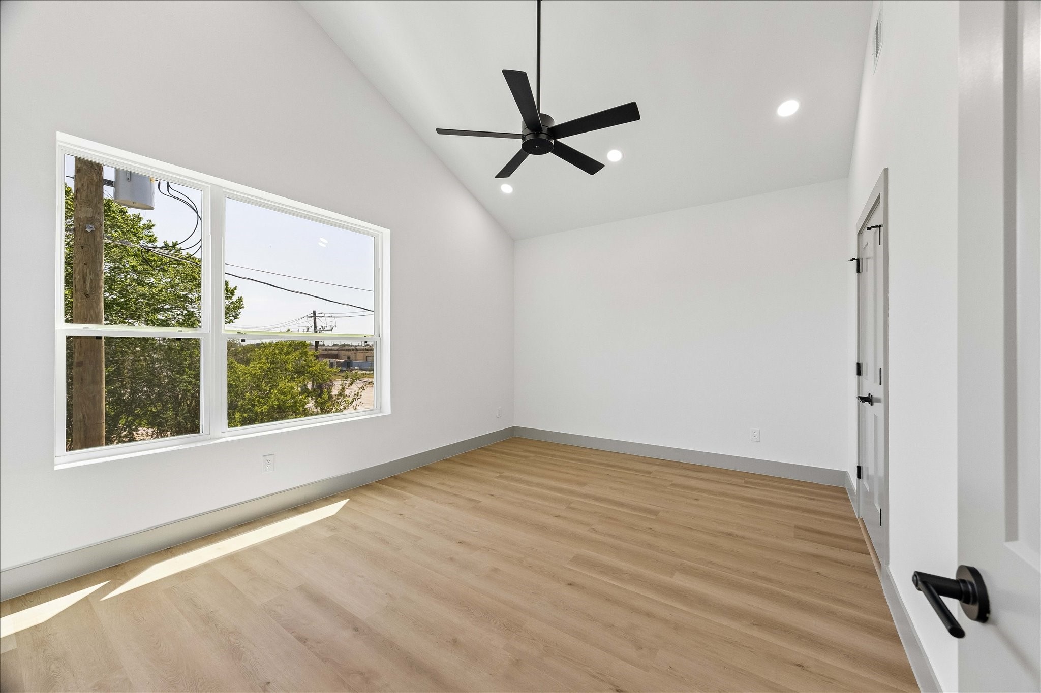 2953 Delafield Street Houston, TX 77023 - Photo 9 of 22 Vaulted ceilings and oversized windows create an airy retreat where soft natural light and calming finishes deliver a boutique hotel atmosphere.