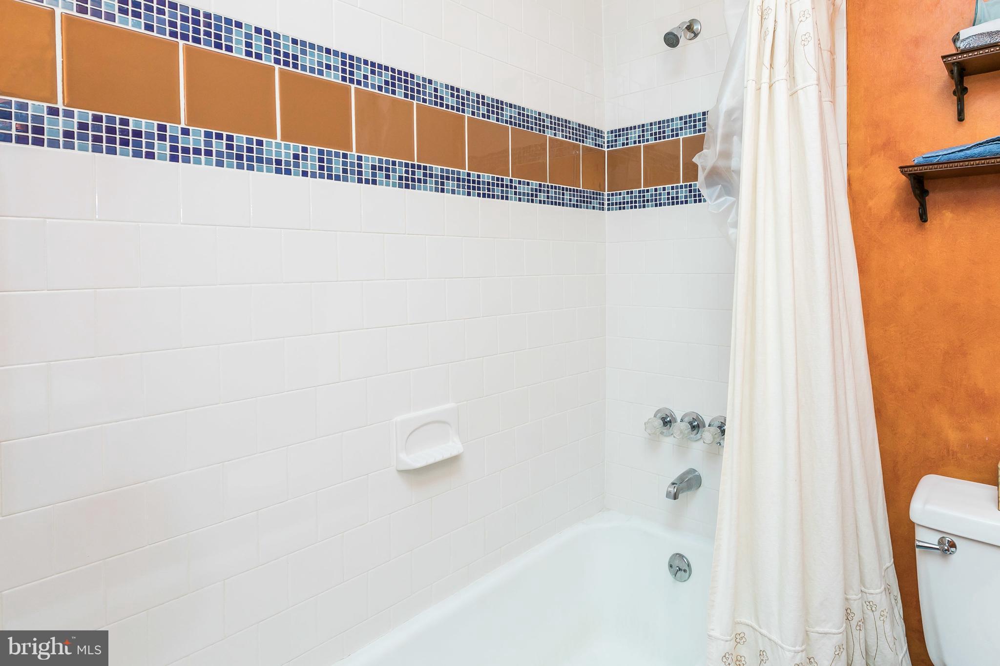 2414 Steele Road Baltimore, MD 21209 - Photo 13 of 24 a bathroom with a shower and a bath tub