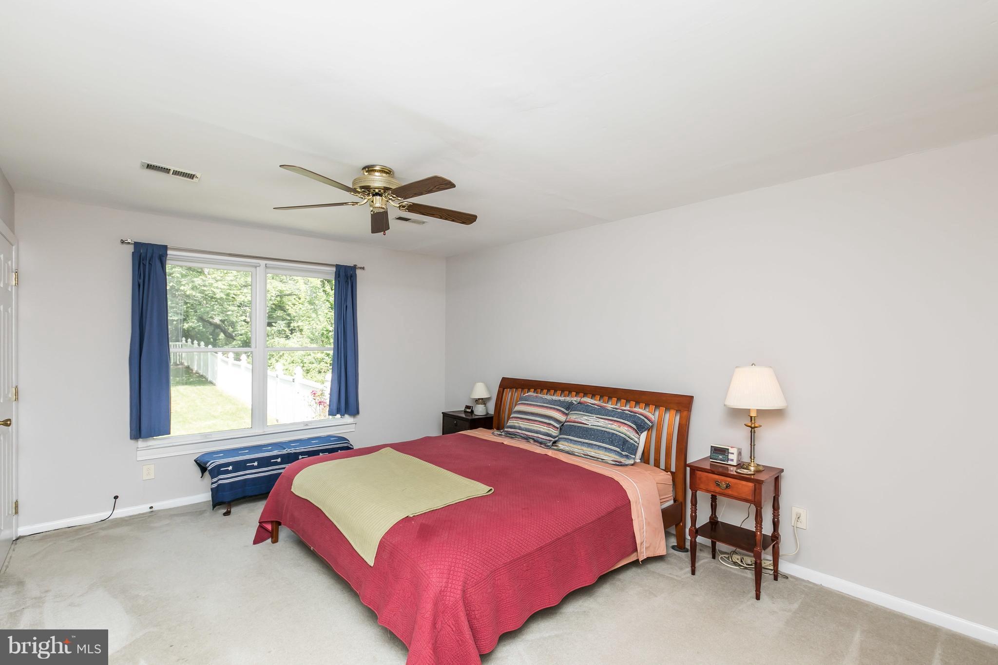 2414 Steele Road Baltimore, MD 21209 - Photo 18 of 24 a bedroom with a bed and window