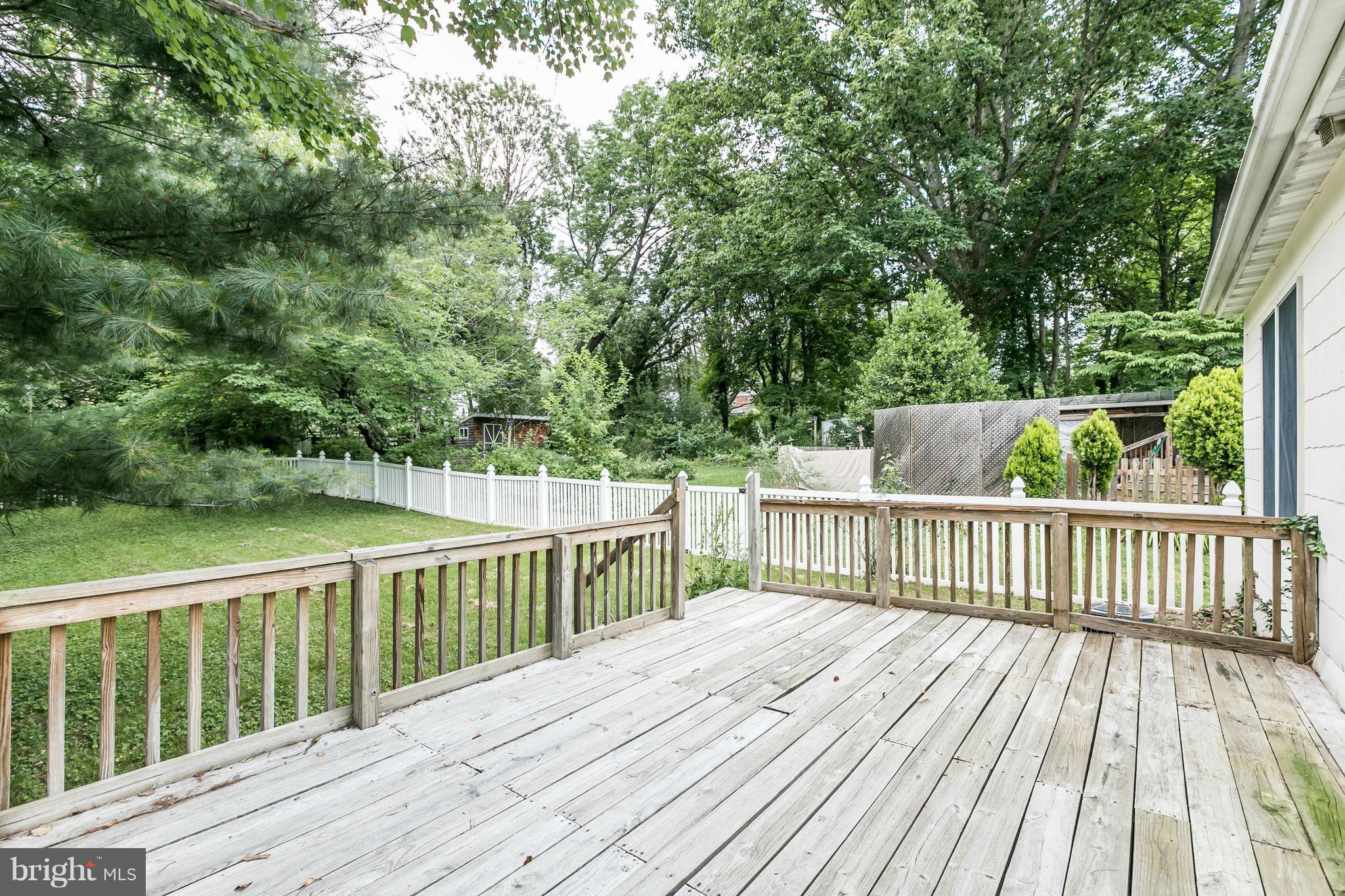 2414 Steele Road Baltimore, MD 21209 - Photo 21 of 24 a view of deck with wooden floor and fence