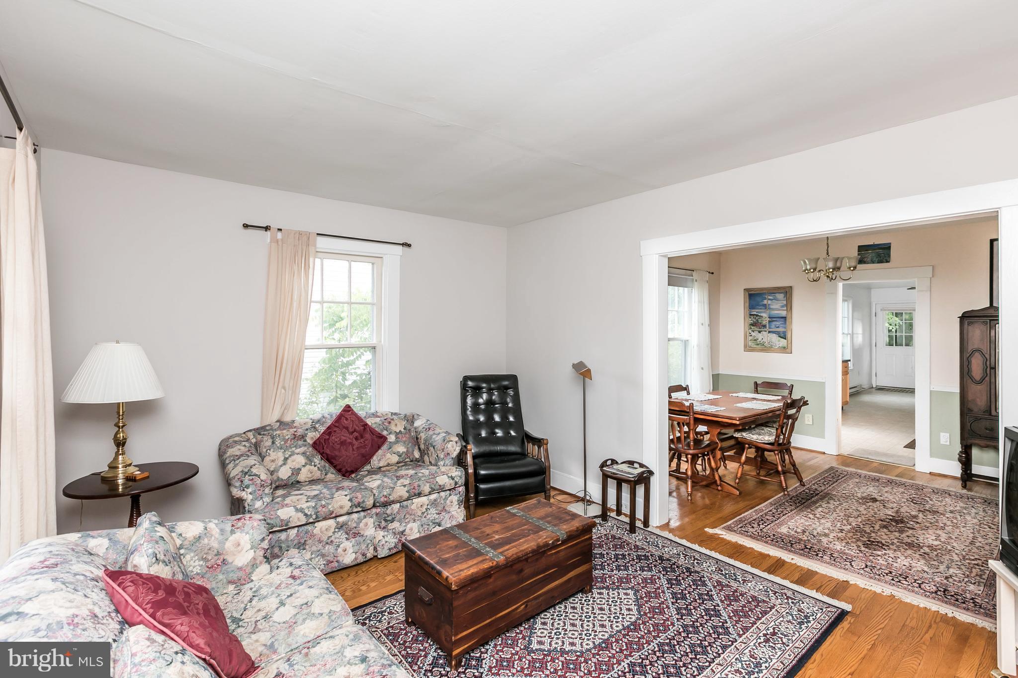 2414 Steele Road Baltimore, MD 21209 - Photo 4 of 24 a living room with furniture and a table