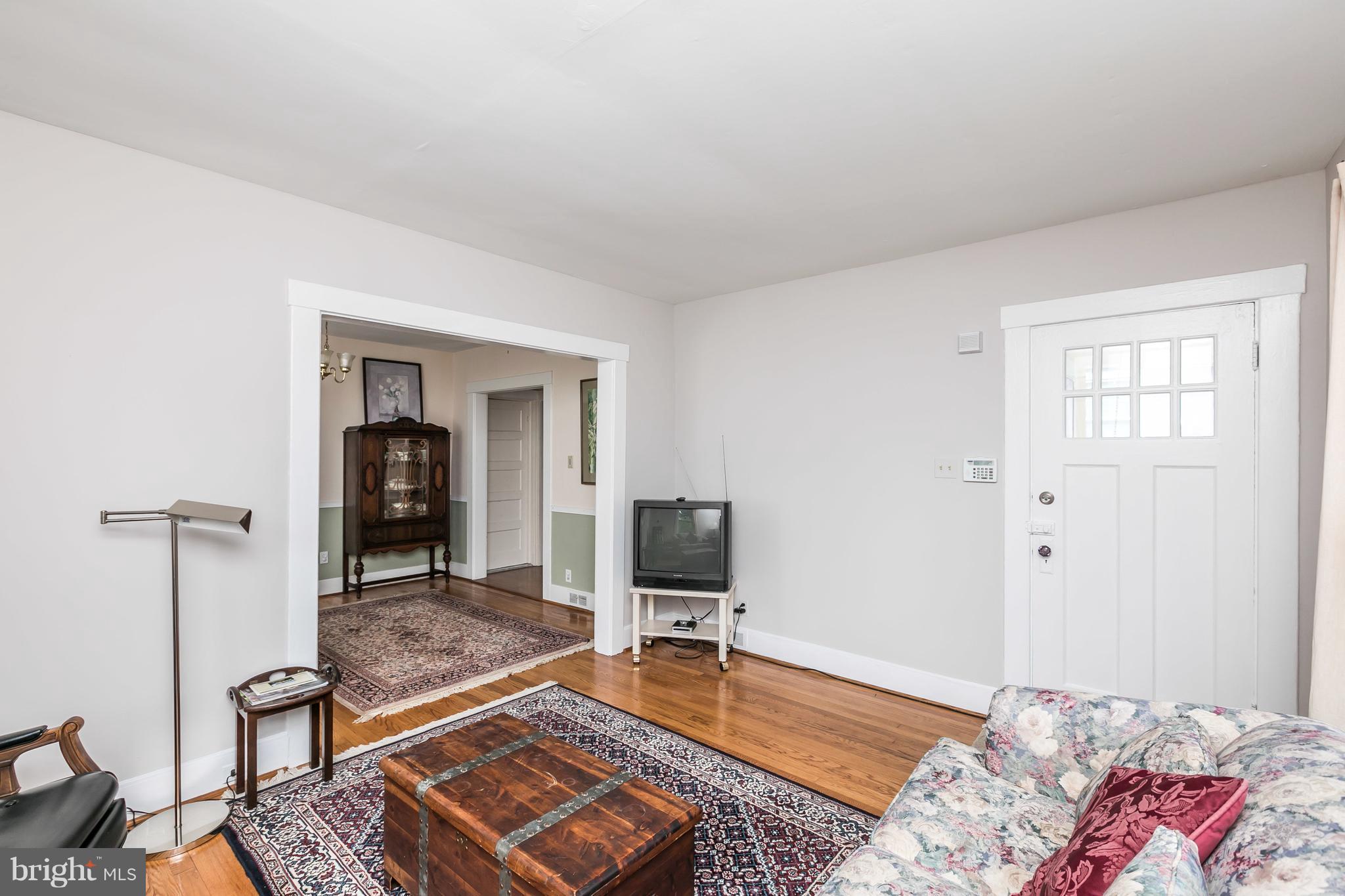 2414 Steele Road Baltimore, MD 21209 - Photo 5 of 24 a living room with furniture and a flat screen tv