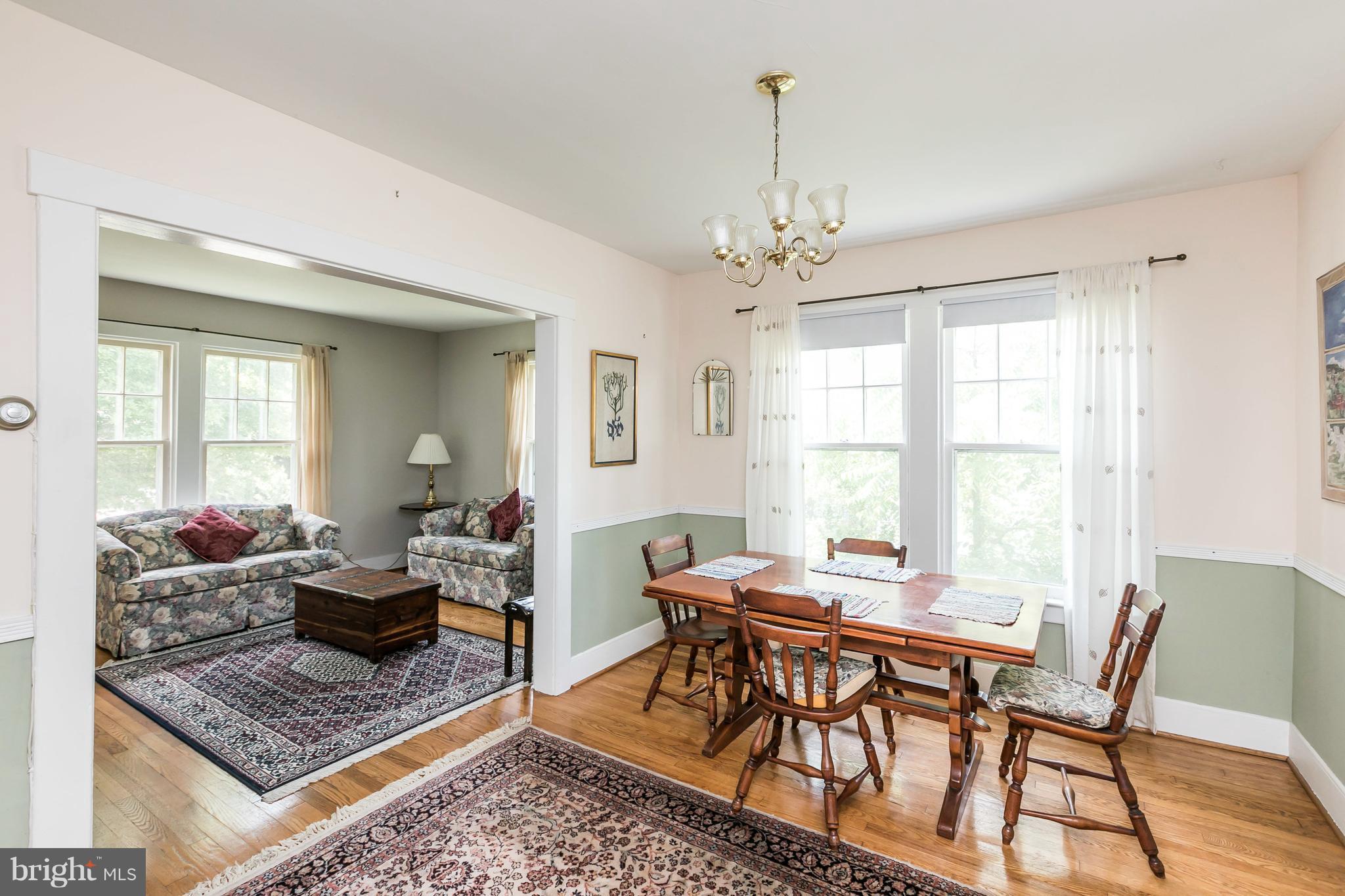 2414 Steele Road Baltimore, MD 21209 - Photo 6 of 24 a view of a dining room with furniture window and wooden floor