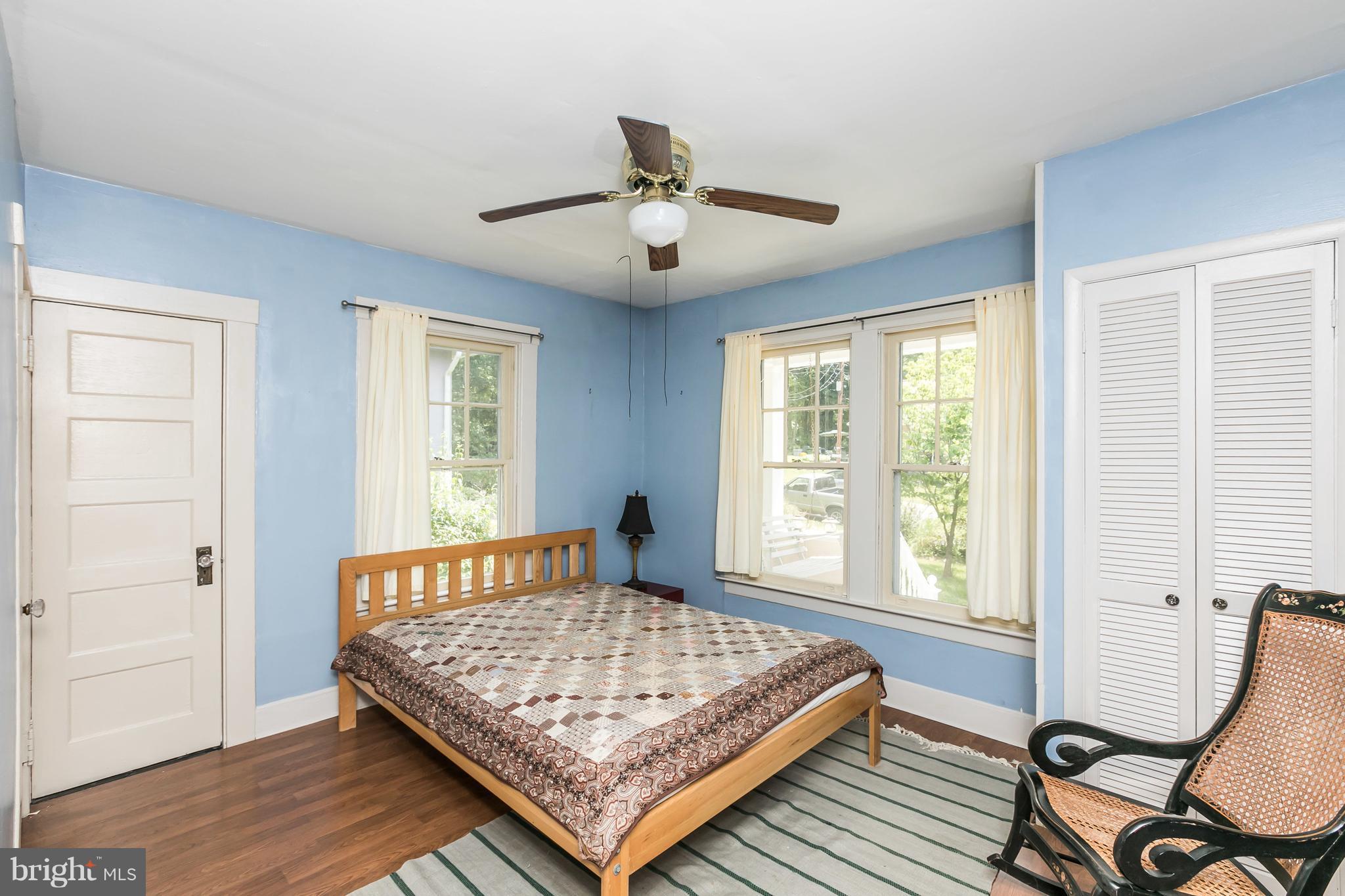 2414 Steele Road Baltimore, MD 21209 - Photo 7 of 24 a living room with a bed furniture and a window