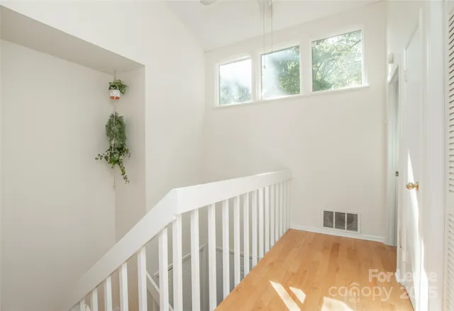 a view of hallway with windows